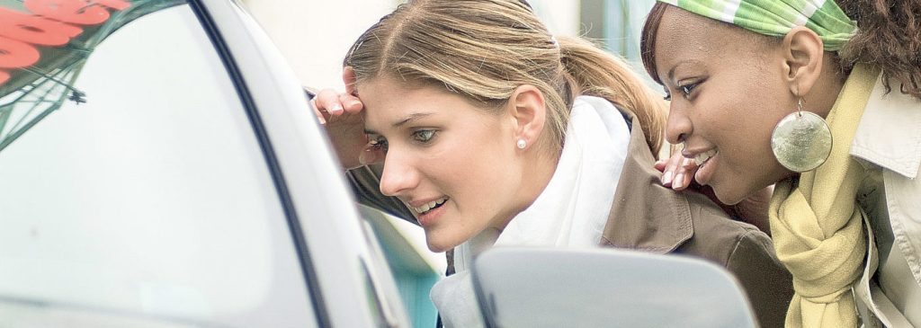 wo young women out shopping, for a new car part of a series.